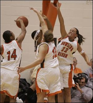 Central Michigan's Latisha Luckett has no luck going up against Bowling Green's Carin Horne, left, Liz Honegger and Ali Mann. The Falcons improved to 16-2, 6-0 in the MAC.