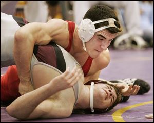 Eastwood's Jeremy Foster controls Genoa's Kurt Wolff in the 171-pound final at the Kerr Tournament. Foster won 10-4.