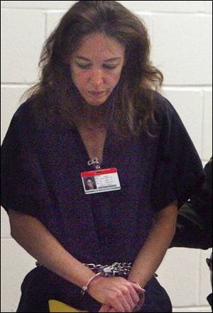 Lisa Nowak, a NASA astronaut, is escorted to court in Orlando, Fla., after she was charged with attempted first-degree murder.