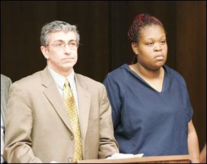 Martina Jennings, with her attorney, Larry DiLabbio, is arraigned in Toledo Municipal Court on one charge of child endangerment stemming from her son's injuries.