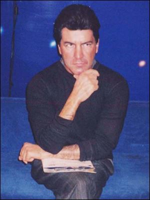 Simon Cowell frozen in his trademark scowl.