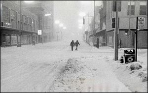 A view to the west at Adams and Huron streets is typical of downtown Toledo s ghostliness as the storm swirled.