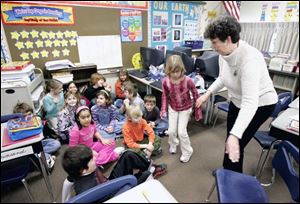 Bowling Green teacher Mary Ann Hoare ushers her third-grade students into the area of the classroom used for lockdowns.