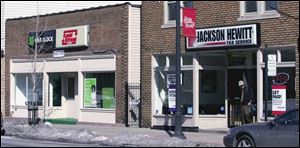 H&R Block and Jackson Hewitt, Nos. 1 and 2 nationally, have side-by-side offices on Lagrange Street in Toledo.