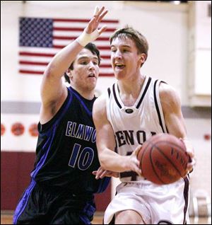 Elmwood guard Ryan Rothenbuhler, the Royals' second-leading scorer at 10.4 ppg, defends Genoa's Justin Lau.
