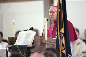 Toledo Bishop Lenoard Blair said the circumstances 'cut us to the very quick' and consoled the slain officer's family during the funeral that they will see their loved one again.
