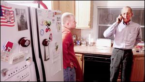 Matthew Keil s brother Aaron, 24, and father, Dave, make preparations to go to Walter Reed to visit the infantry sergeant, who was on his second tour of duty in Iraq when he was wounded.
