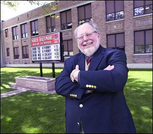 Rick Van Mooy, retired superintendent of North Baltimore schools, and others said nonpartisan voting could save money on primary elections.