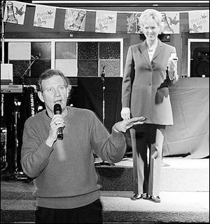 WTOL-TV news anchors Jerry Anderson and Chrys Peterson participate in a  fund-raiser for the Fair Housing Center.