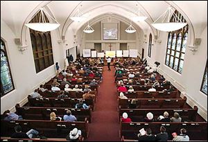 City council members and citizens gather at Augsburg Lutheran Church.
