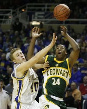 Mac Cloud of Findlay, right, breaks up a pass intended for St. Edward's Delvon Roe in yesterday's Division I regional final.