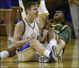 Findlay's Luke Kraus doesn't appear happy after being called for charging against
Lakewood St.Edward's Pe'Shon Howard. The Trojans finish the season with a 20-4 record. 
