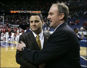 Xavier coach Sean Miller, left, greets Ohio State coach Thad
Matta before the game. Miller used to be a Matta assistant.