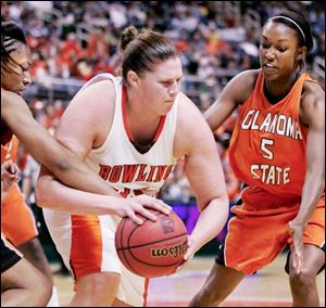 The Falcons  Liz Honegger looks for some room against the Oklahoma State defense in East Lansing, Mich.