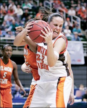 Bowling Green s Ali Mann rips down one of her 13 rebounds
during the second half of the Falcons  opening-round victory.