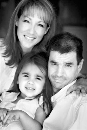 Jim Steel with his wife, Karin, and daughter, Delani. Karin is with her husband around the clock.