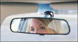 Haley Lancaster has learned some of the key safety habits, including frequent mirror checks.