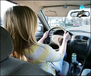 Haley Lancaster has learned some of the key safety habits, including frequent mirror checks and using the seatbelt.