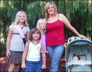 Alicia Castillon with her children, from left, Katie, Rhyan, Madison, and Zayne. Castillon and her boyfriend, John Mitchell, were shot to death March 29 in her Bowling Green home.