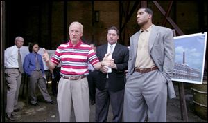 Relations have soured between Mayor Carty Finkbeiner, left, and Toledo Steam Plant developers David Ball, center, and Jim Jackson, shown at a press conference in August that focused on the status of converting the vacant riverfront building into upscale residences.