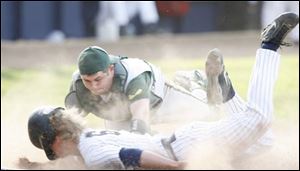 St. John's Mike Wilson got a face full of dirt but also scored a run in the third by beating the tag of Clay catcher Rex Groll.