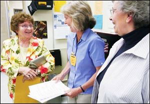Coy ELementary School music teacher Deb Evans, center, chats with Doris Wilka Kocik, left, and Carol Myers Agnew, right. Ms. Kocik wrote the music for the Coy song, and Mrs. Agnew wrote the lyrics.
