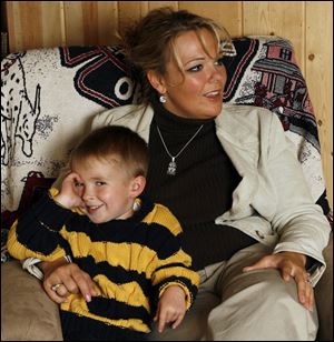 Danielle Dressel, with her son, Noah, has attended dozens of functions since the night her husband was killed on duty.