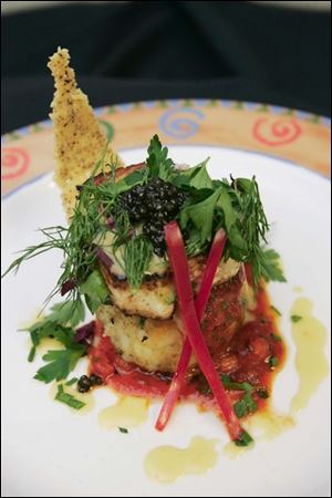 Chef Rick Whitehead made Crusted Wahlu Escalor with White Bean and Spinach Risotto drizzled with lobster beurre blanc.