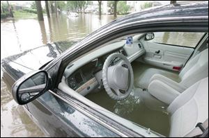 A vehicle captured by the waters on Franklin.