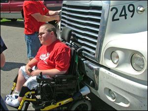 Ben Carpenter, 21, was crossing a street in front of a tractor-trailer when the light turned green. The truck driver didn't see Mr. Carpenter, whose wheelchair got stuck in the truck's grill.