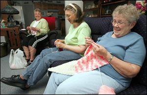 From left, Marilyn Roth, Christine Hampshire, and Betty Ten Eyck of Calvary Lutheran Church s prayer shawl ministry.
