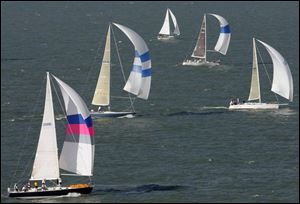 The Sagitta, foreground, captained by Jon Somes, competes in the Mills Trophy Race.

