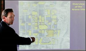 Patrick Zohn, a partner with The Gateway Group, a sports consulting firm in Cleveland, reviews the downtown Toledo location of the new multipurpose arena.