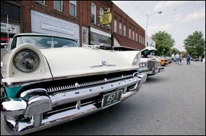 Acres of chrome grace the grill of a 1956 Mercury Monterey, top, on display at Pemberville's first Cruising Night. 