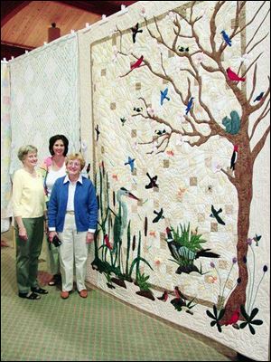 Among items to be auctioned is the 2007 feature quilt, Spring in the Swamp. Measuring 97 by 116 inches, the quilt was designed by Kathie McClarren of Wauseon and Mary Clark of Sylvania, pieced by Carolyn Snyder of Pettisville, Ohio, and hand-quilted by volunteers at Zion Mennonite Church in Archbold, Ohio. More than 17 animals and birds native to northwest Ohio are represented in the design.
