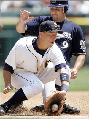 Milwaukee's Tony Graffanino beats the throw to Detroit's Brandon Inge as he steals third base. ASSOCIATED PRESS