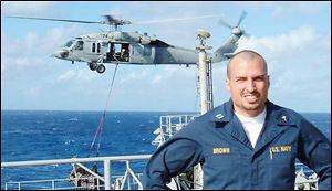 Lt. Dale Brown, an ordained minister and U.S. Navy chaplain from Columbus, is serving
in the Persian Gulf.