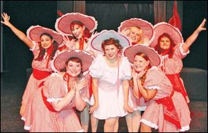 Miss Adelaide (Maribeth Stahl), center, is surrounded by the
Hot Box dancers, clockwise from bottom left, Victoria Monhollen
Clyce, Jenny Kormanyos, Cindy Bilby, Sara Swisher, Ashley Begley, and Jeannine Stramel.