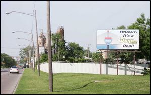 A billboard on the Trail posted by a Chevy Olds dealer features the bridge shape and declares the I-280 crossing a  Dunn deal.  