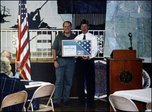 Kevin Sonnenberg, left, and Bob Kane pose for a photo.
