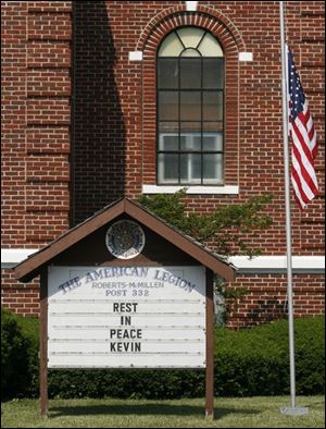 The sign at the American Legion Post says all the town
can say at the moment for its native son who died in Iraq.