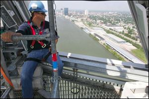 Wade Bonzon of Figg Bridge Engineering, which designed the Skyway, checks out the top of the pylon. When maintenance crews go to the top, the elevator ride will take seven minutes.