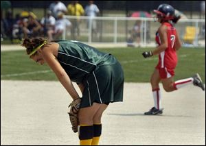 Monroe St. Mary Catholic Central pitcher Megan Drabek 
regroups after allowing a home run in the sixth inning.