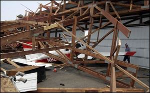 Last year s storm damaged both hangars at the Wood County Regional Airport and 18 aircraft that were parked inside.