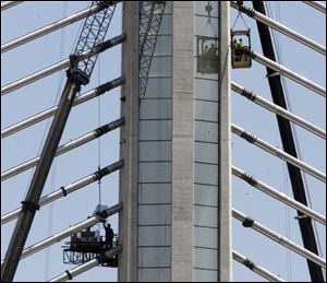The pylon that holds 20 cable stays is anchored by 17 foundation shafts drilled 15 feet into bedrock beneath the Maumee River. The cables are protected by stainless-steel sheathings.
