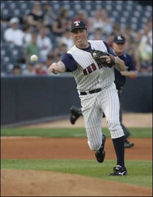 Hens third baseman Mike Hessman throws out the Indians' Brian Bixler in the third inning. But Hessman's best work came at the plate as he drove in five runs.