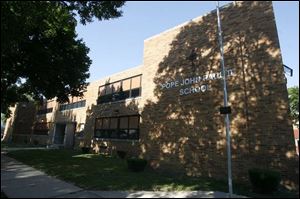 Pope John Paul II School on Lagrange is raising its  cost of education  from $1,800 to $4,019 come fall, and is one of four Toledo Catholic elementary schools doubling tuition costs.

