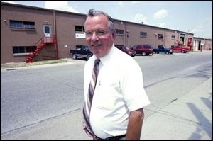 Mayor Douglas Johnson, outside the plant, says the operation to make game and movie packages is 'great for Bryan.'