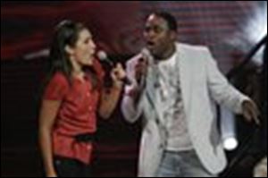 Wayne Brady encourages contestant Kate Moeser during an episode of the new Fox series 