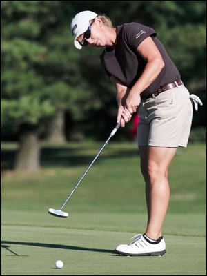 Carrie Wood putts on the 18th in the Farr Classic first round. She started with four birdies and finished with a 68.
